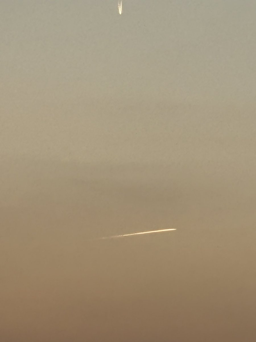 The 8yo took this photo tonight over Epsom racecourse. No idea what it is meant to be.