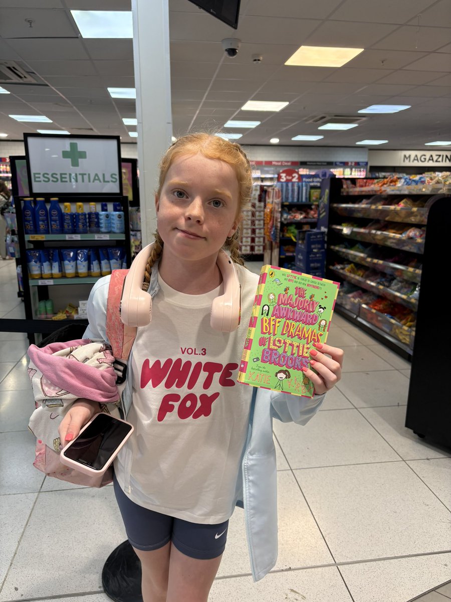 IW from Y6 to be… choosing a book in the airport with her voucher from school sports day program picture competition <a href="/IntakeSchool/">Intake</a> #summerreading 📖