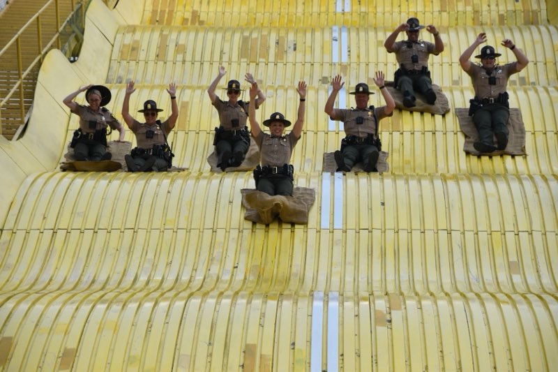 ISP traditions and family fun at the Illinois State Fair! 🌟 First Deputy Director Rebecca Hooks and a few of our troopers took on the big yellow slide. If you come out to the fair today don't forget to stop by the ISP Safety Education Tent near the Grandstand. Troopers are ready