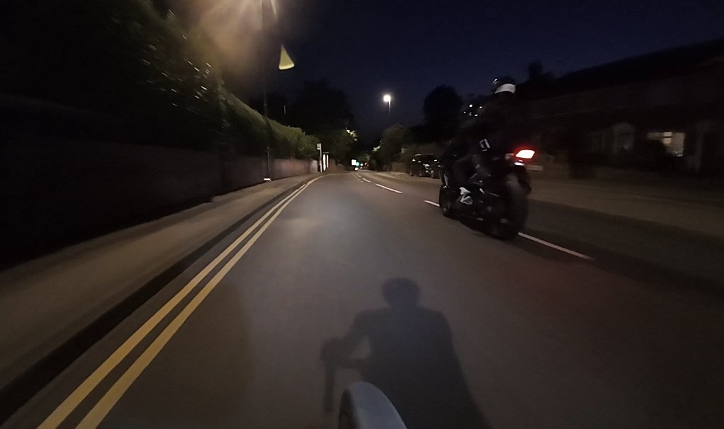 *Something about cyclists and number plates* (NB: they went through a red light shortly after this)