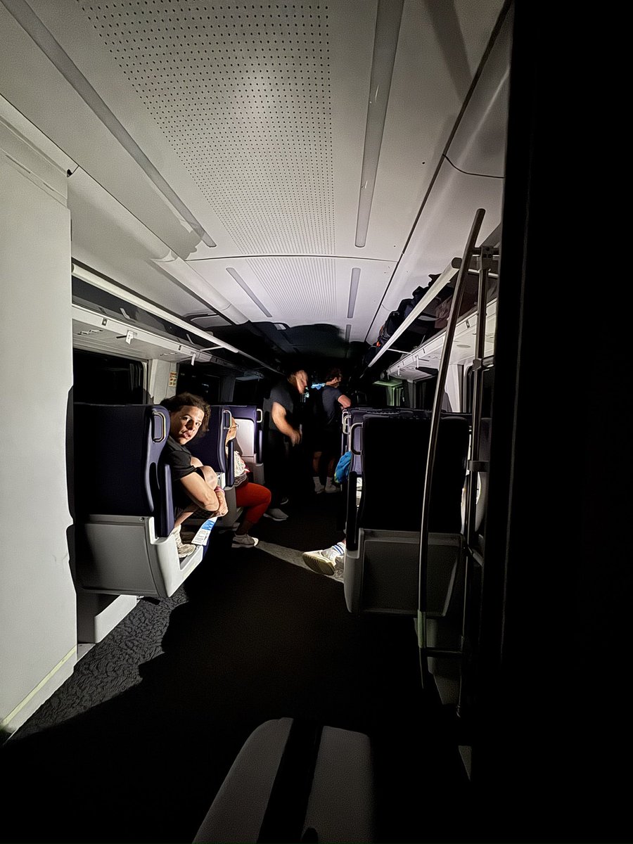 Sapi_99's tweet photo. 5 hours stuck on an Amtrak train outside Battle Creek MI: no power, no plumbing, lights out, mosquitoes everywhere. Buses never showed. At 11:30pm we were told to walk along the tracks to the nearest street—police said they were only just notified. 
What’s going on, @Amtrak ??? https://t.co/BUF6pdhJRR