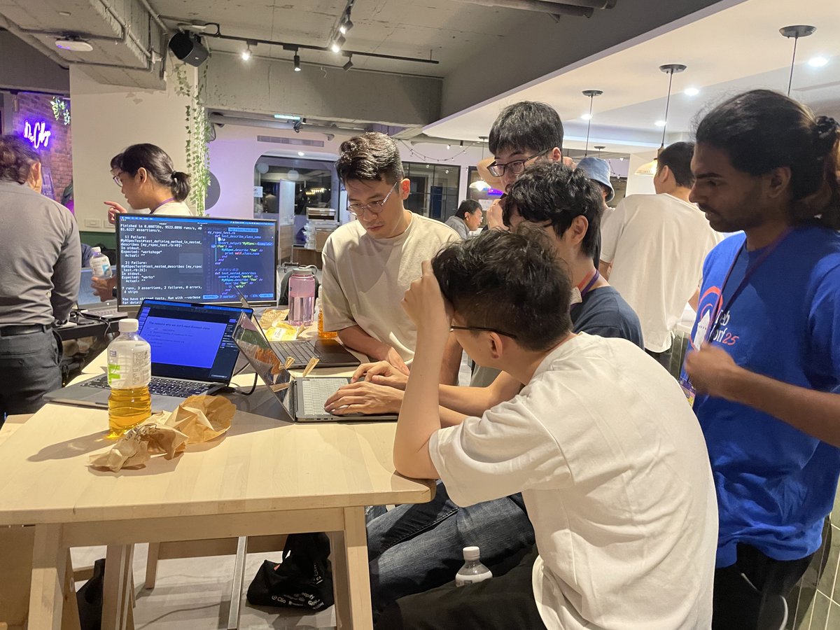 rubyconftw's tweet image. The “Metaprogramming with Ruby” table hosted by @okuramasafumi tried building a simplified RSpec clone.
Everyone frowned together at the metaprogramming code. 🤨 Matz wandered by with a 車輪餅 and joined in.
2025-08-09 #CodeParty #RubyConfTW #COSCUP