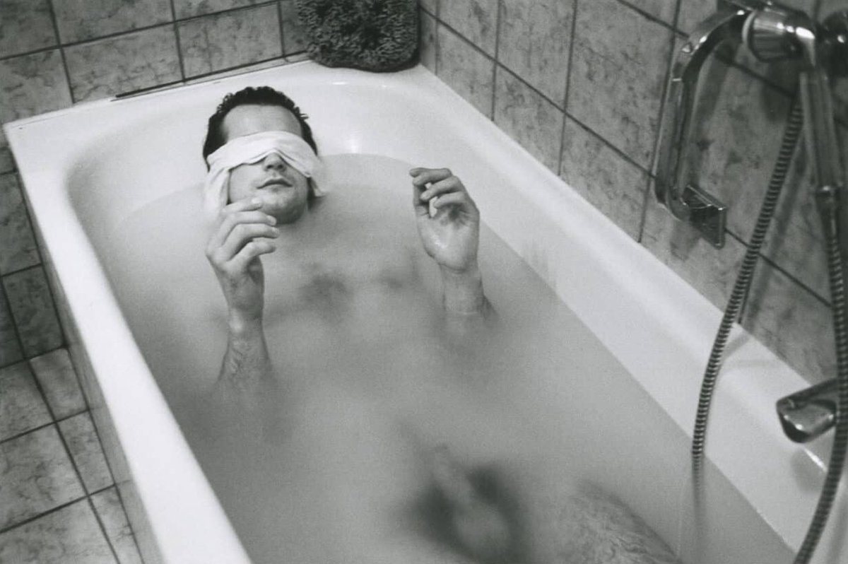 Thierry in the bathtub, blindfolded. By Hervé Guibert.