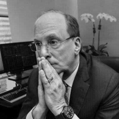 Worried man in suit clasping hands in prayer pose, representing market anxiety
