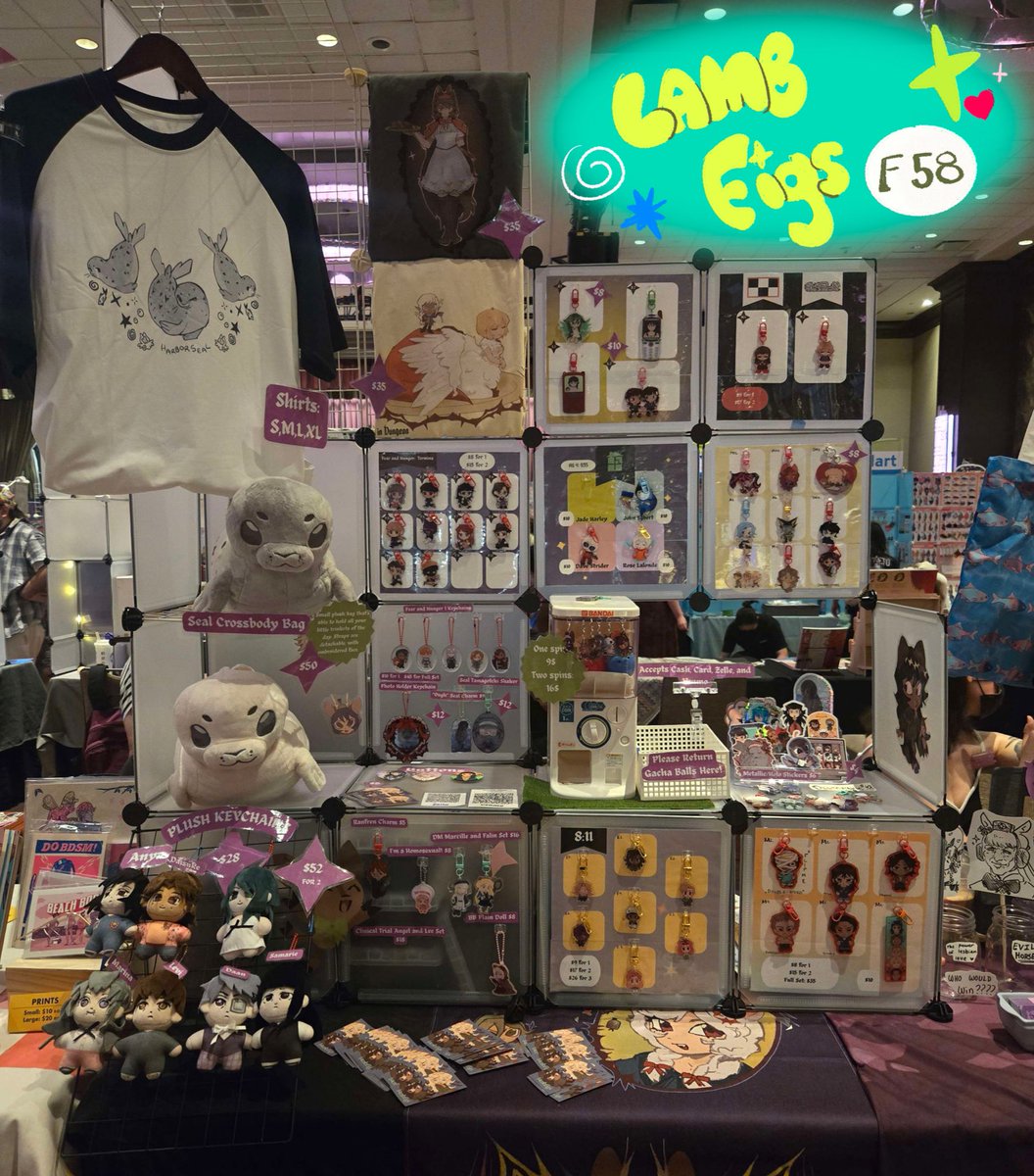 Im at flame con!!! come swing by 🦭🦭 table F58