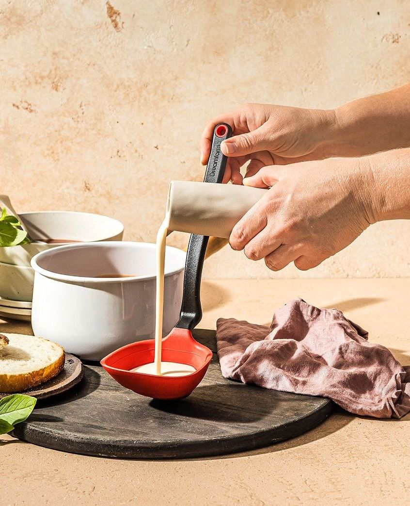 Made to measure. 

Fladle is a ladle that folds flat for storage, measures ½ cup and ¼ cup measurements, scrapes the bottom of your pans, and hooks to rest on the edge of a pot. 🤯

dreamfarm.com/fladle