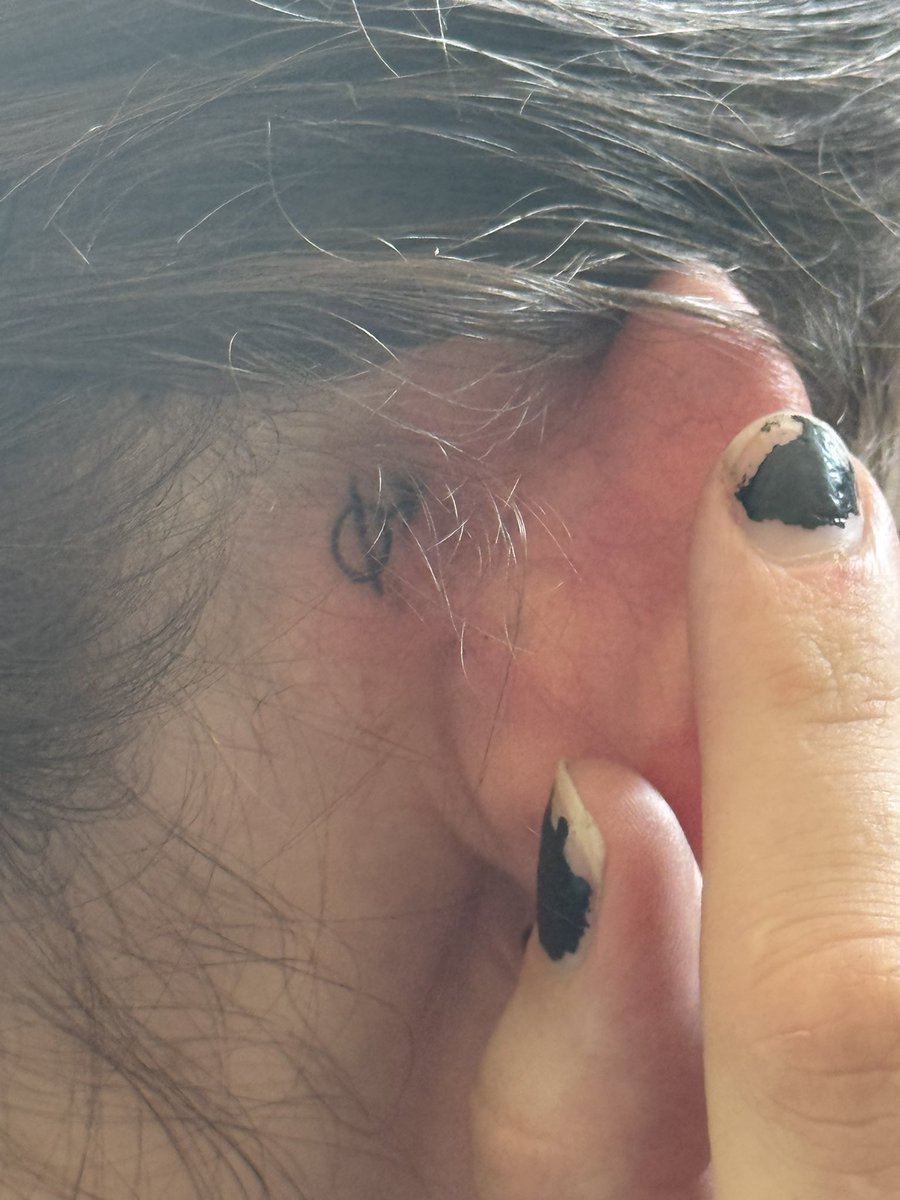 i went to the vet today and idk why but they gave me this awesome tattoo the symbol is so cool!!!! can anyone tell me what it means ://