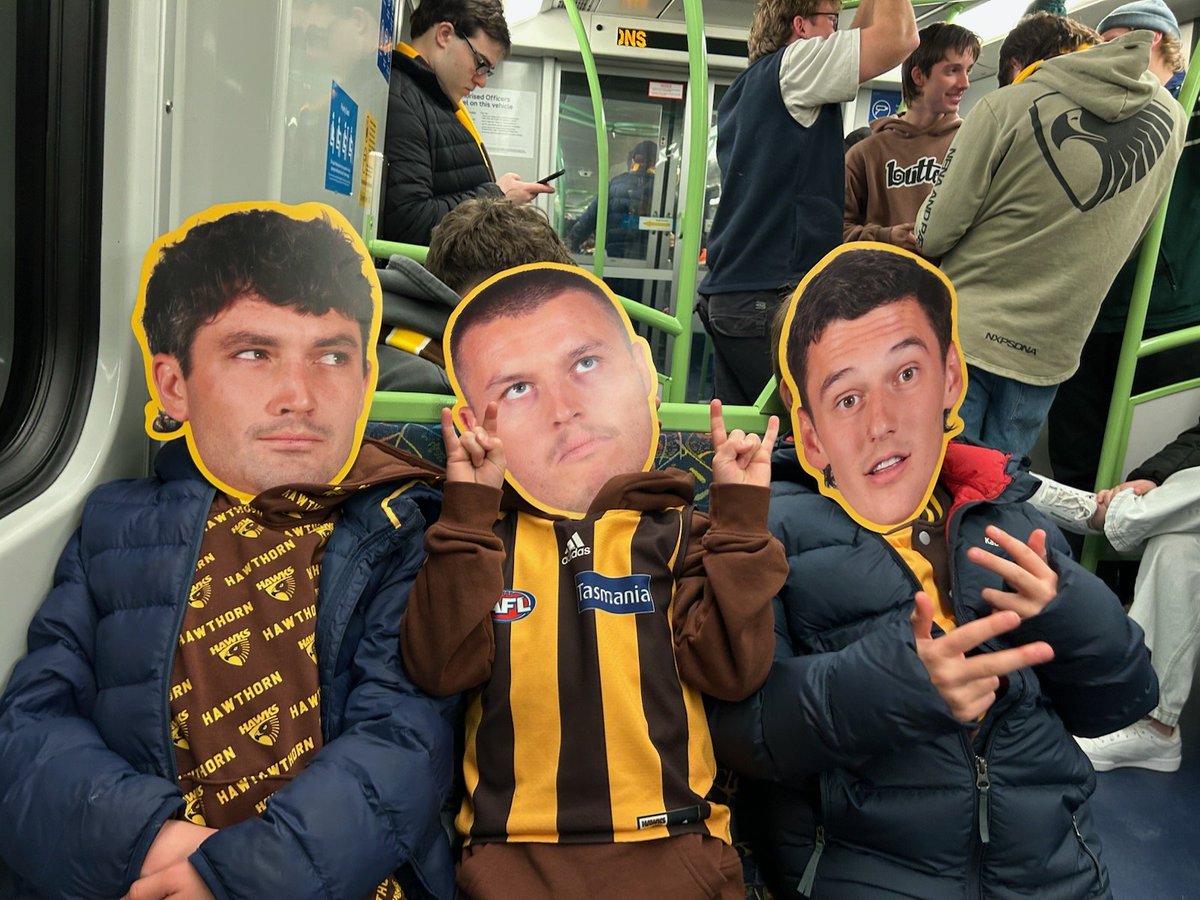 eshadlow's tweet photo. My train trip home from the footy got kinda weird #AFLHawksDees https://t.co/jYYFu6UvTg