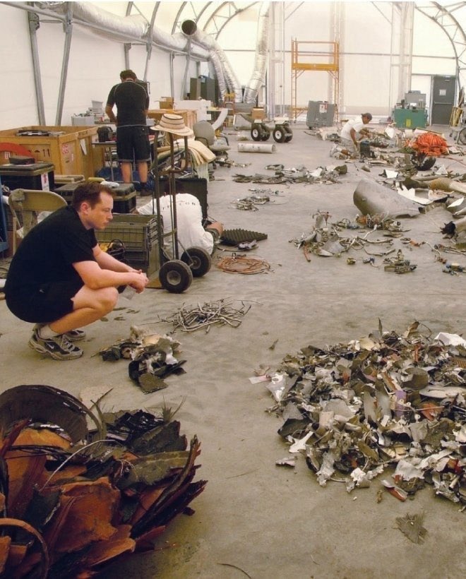 Elon Musk examining the debris from Falcon 1's first flight in 2006

They've come a long way