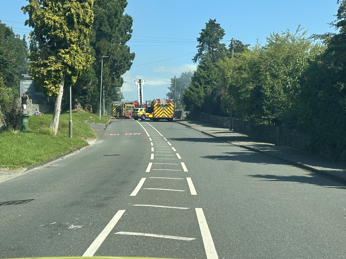 CumbriaRoadsPol's tweet photo. Milnthorpe Road #Kendal currently CLOSED between Kent Park Ave and Bellingham Rd due to property fire. @CumbriaFire at scene and dealing. Delays likely. No casualties or injuries reported @CumbriaRdWatch @Cumbriapolice https://t.co/qfMQ1Aa0ss