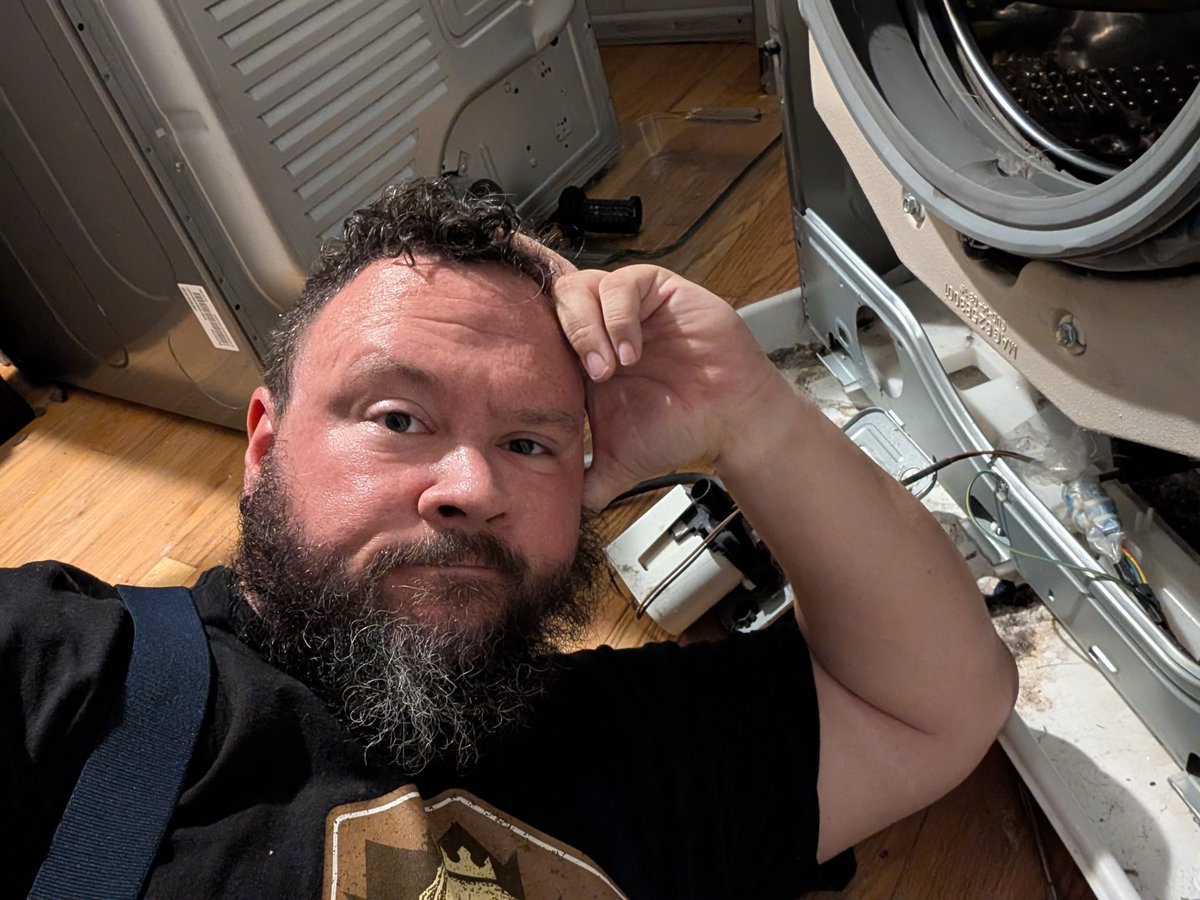 Waiting on Jake to grab me a tool... With possibly just 2 weeks left in our place, the washer's pump failed.  The choice was, spend $15 on a replacement pump, $350 on a service call, or use a Laundromat for the next two weeks... We're replacing the pump.  Thanks YouTube!