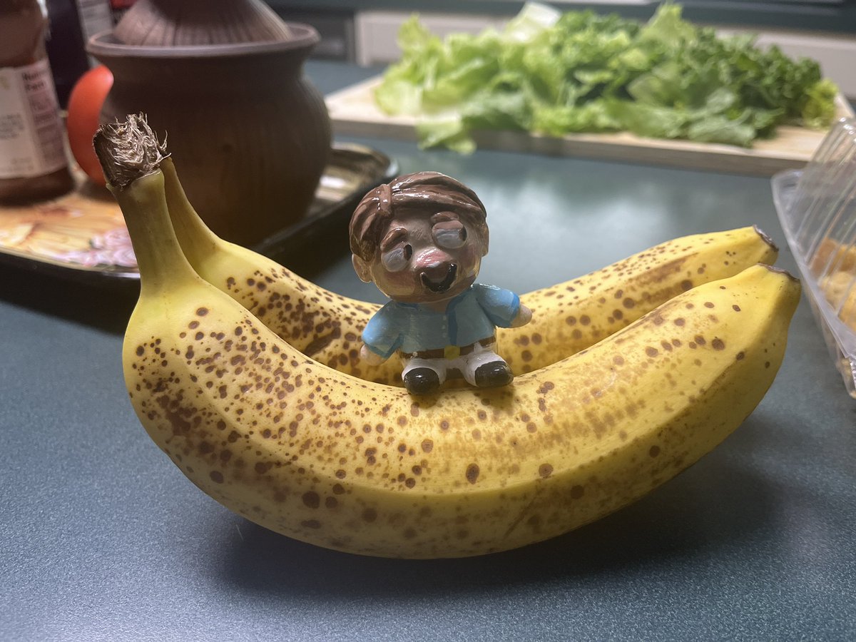 succession never dies here’s roman roy sitting on a banana
