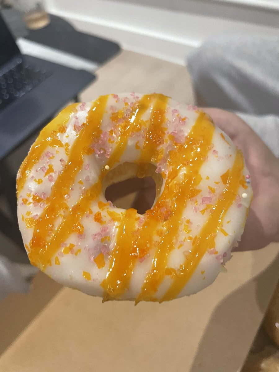 donut box with a new mango raspberry donut! 🥭