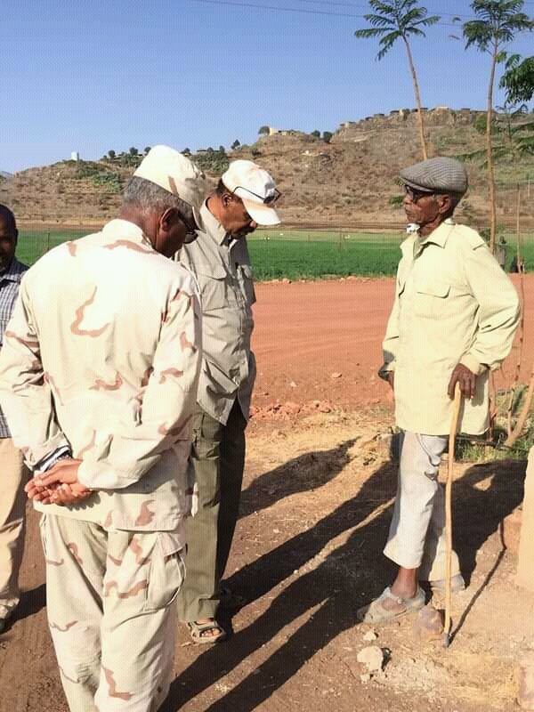 A picture worth a thousand words ‼️ 
This picture captured the moment in epic snapshot, President Isaias Afwerki and his general are locked in a intense ground-staring contest at Eritrea’s grand Green Legacy Initiative, wondering if the seeds are just shy or staging an