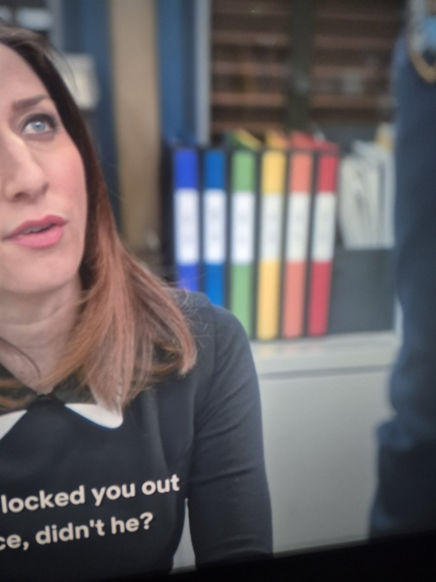 SometimesKatecd's tweet image. Bored at work so watching brooklyn 99, I just noticed the files behind Gina are the pride flag. Probably just slow on the observation