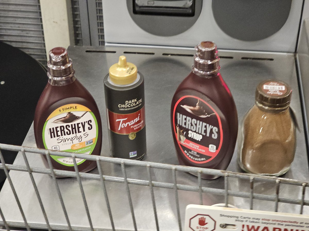 agitbackprop's tweet image. We bought four things of chocolate syrup so we can be sure which one makes the best milkshake