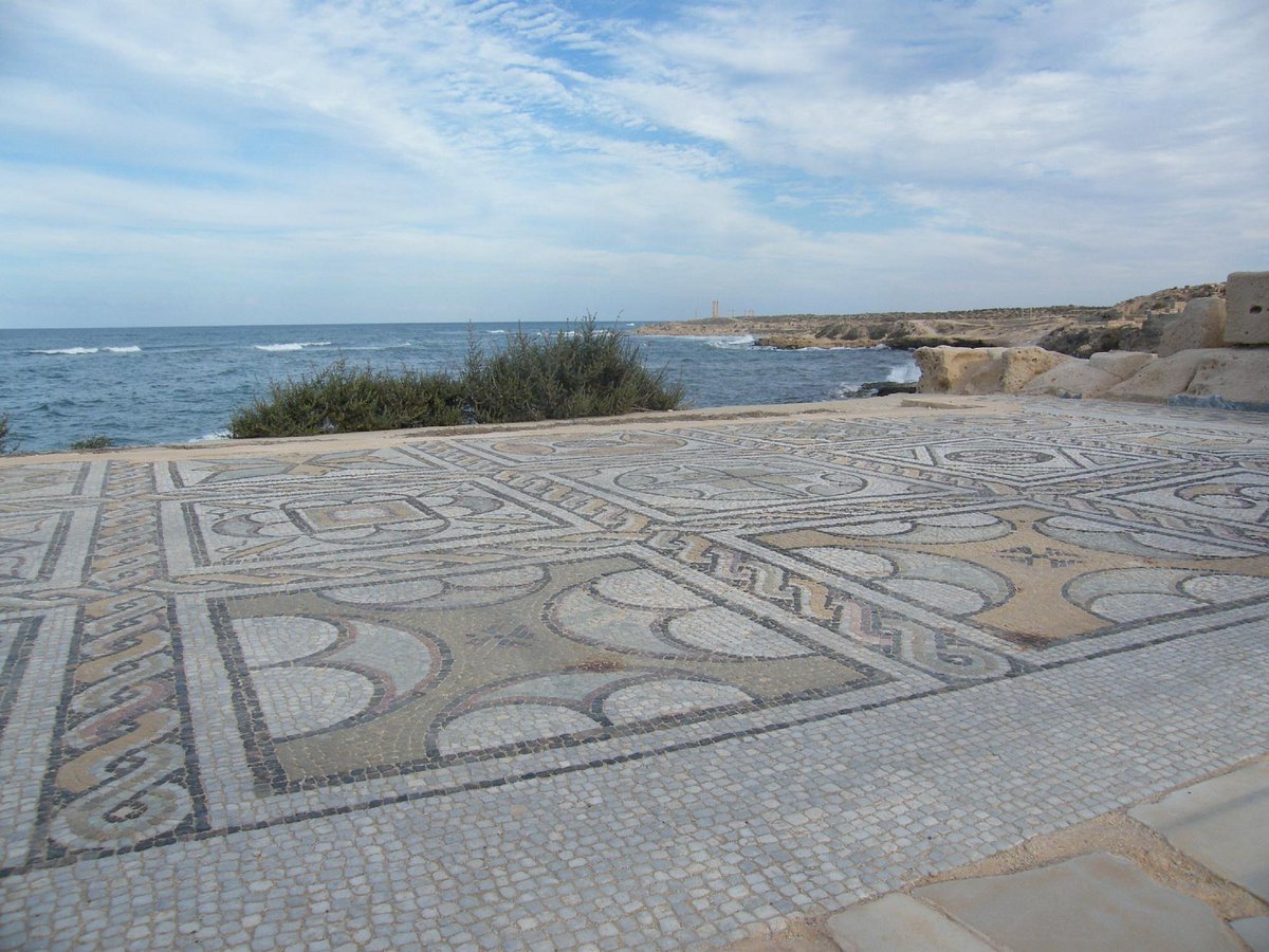 DrJEBall's tweet image. A #Roman mosaic in the city of Sabratha (in modern Libya), with the Mediterranean Sea as a beautiful backdrop #MosaicMonday #Archaeology (📷 squirrelsnuts)