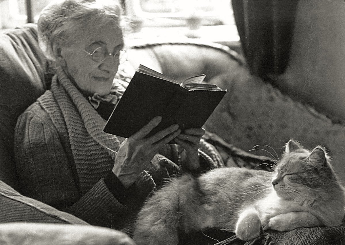 Elderly woman with cat sitting in her lap, ca. 1943 - by Kurt Hutton (1893 - 1960), German/English