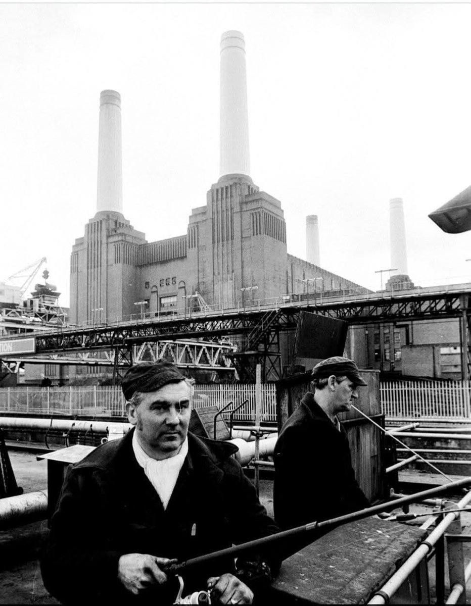 moosh (@mongsley) on Twitter photo Two workers in 1981 fish from a wharf on the River Thames just in front of the towers of the power station Two workers in 1981 fish from a wharf on the River Thames just in front of the towers of the power station