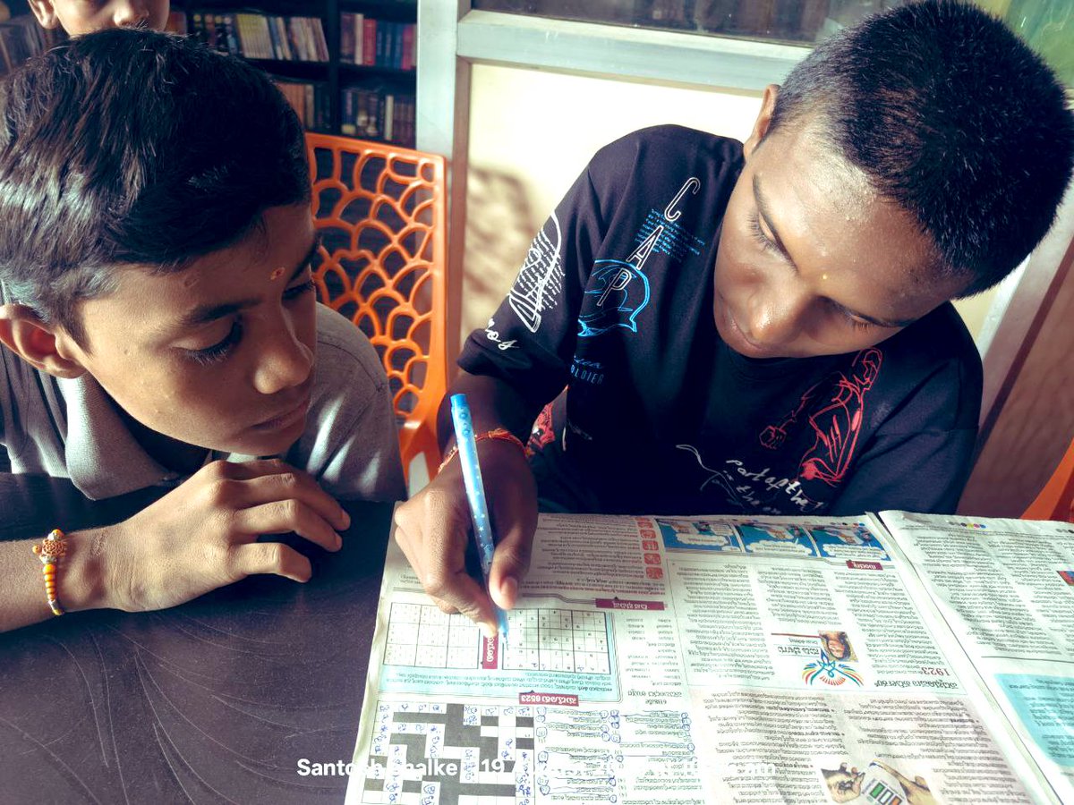“I am always doing that which I cannot do in order that I may learn how to do it.” - Pablo Picasso. 

Young boys solving crossword &amp; sudoku puzzles in the daily newspaper.

#publiclibrariesforall