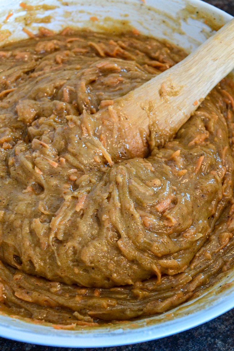 Pour the wet into the dry, mix until  just combined and then add in the freshly grated carrots and mix them in. By the time you are doing this, your oven should be preheating as we have reached the end of the prep youtu.be/HwDRSmV2BxU