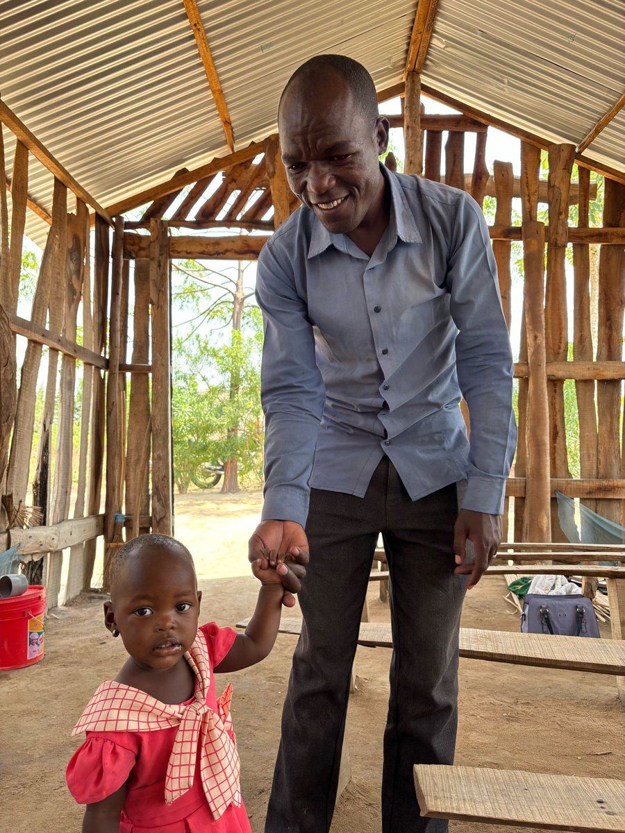 gassmattd's tweet image. Pastor Elisha (of Kisesa) and his oldest daughter.