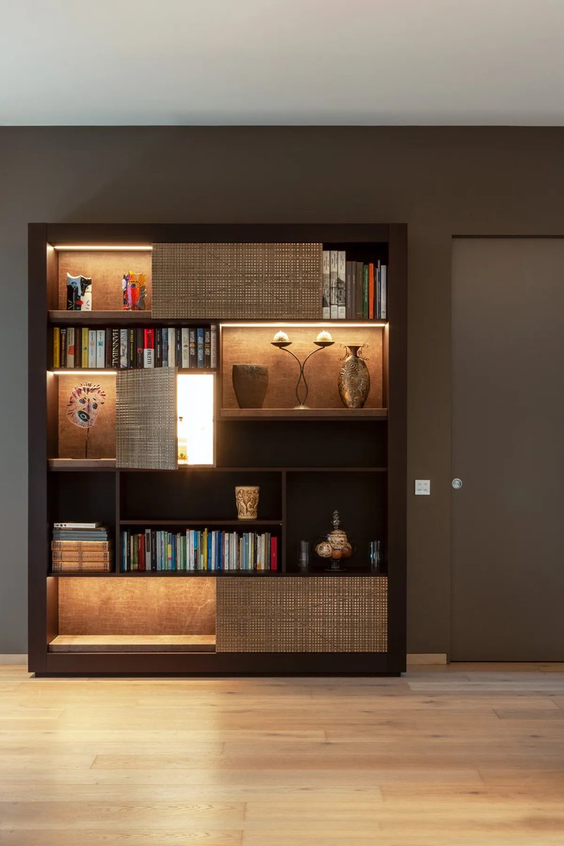 MateriaMiami's tweet photo. Custom bookcase combines the depth of wenge wood, the brilliance of Liquid Metal bronze, and the strength of leather niches. With doors adorned by Maxima carving and every detail crafted to perfection, it’s more than furniture—it’s an experience for both the eye and the touch. https://t.co/LtmMz2k7IA