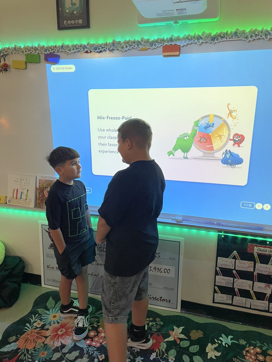 Students practicing their whole body listening while they share about their summer!