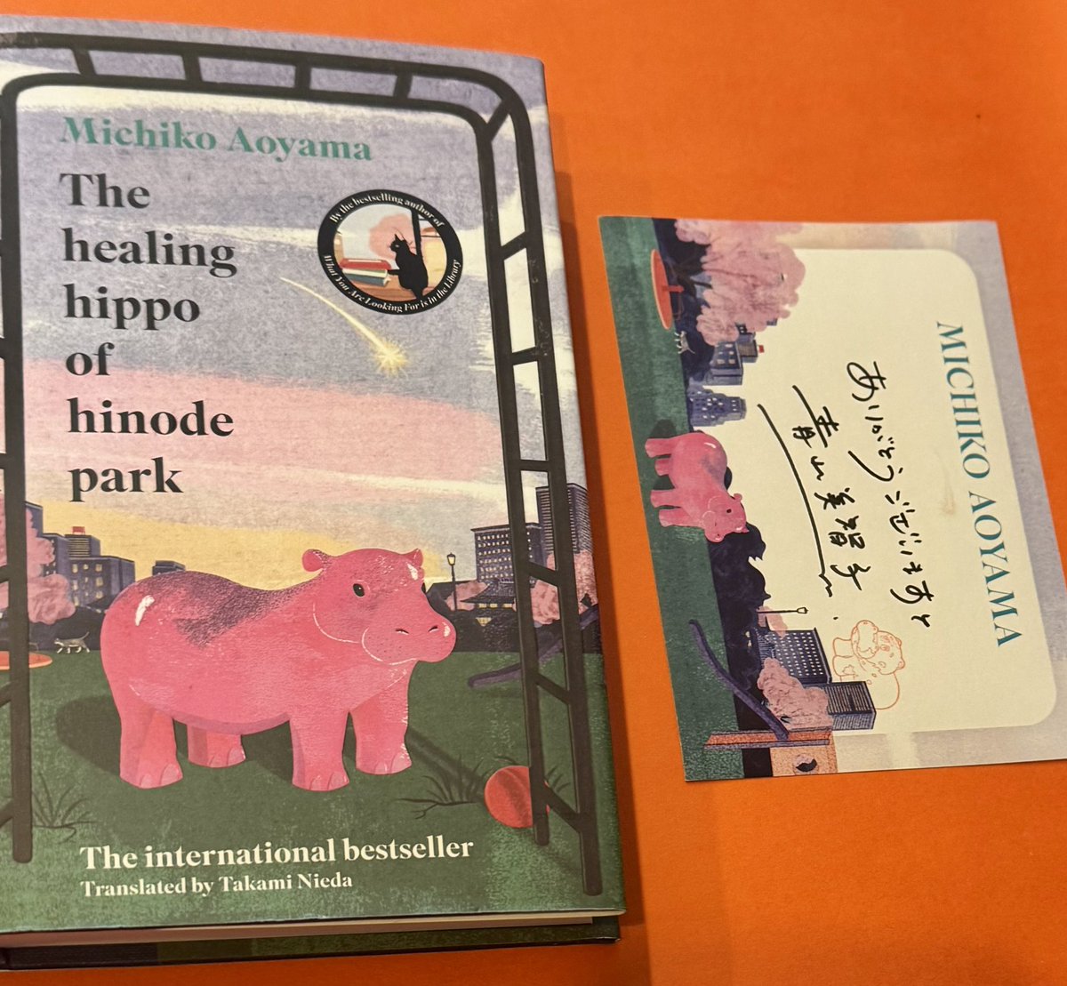 ✨#SIGNED BOOKPLATE EDITION✨

From Michiko Aoyama (author of What You Are Looking For Is in the Library) and Takami Nieda (translator) comes a new uplifting Japanese novel:

The Healing Hippo of Hinode Park 🦛🌸
A quietly powerful story of hope, friendship &amp; connection - a