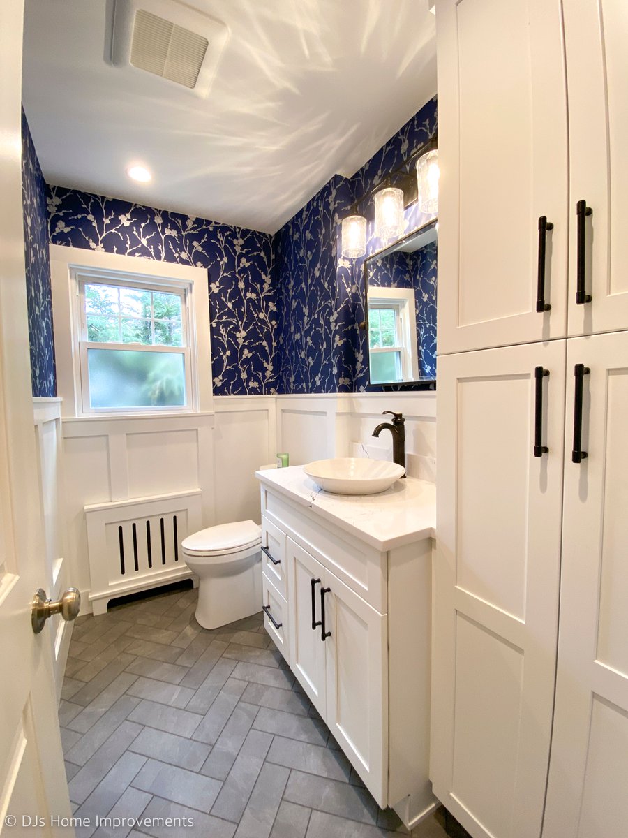 djshomeimprove's tweet photo. This powder room remodel blends timeless details with bold blue accents for a sophisticated finish. The lower wall paneling is painted in @Benjamin Moore Paper White, creating a crisp base, while the upper walls feature a blue wallpaper that ties together the room’s rich blues. https://t.co/4TNxyiaScK