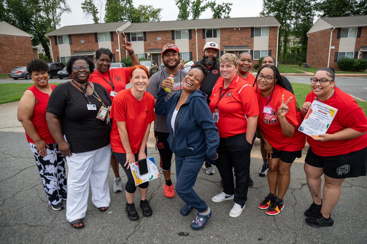 ABSSPublic's tweet photo. Seeing red today? ❤️ It was probably Graham Middle School staff taking their staff meeting to the streets, visiting their school community!  They spent time connecting with residents and promoting open house! #BacktoSchool #ThisisABSS #ABSSCommunity https://t.co/3OGMgVR1qe