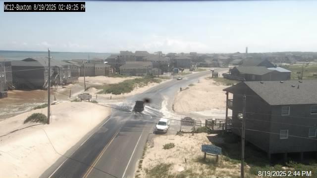 NWSMoreheadCity's tweet photo. We are still about 2 hours away from this evening's high tide, and water is already beginning to impact some areas along the Outer Banks. Here is the view along NC-12 in Buxton (courtesy @NCDOT_NC12 ). Please try to avoid flooded roads. #Erin #ncwx https://t.co/YoLDIxV2Tz