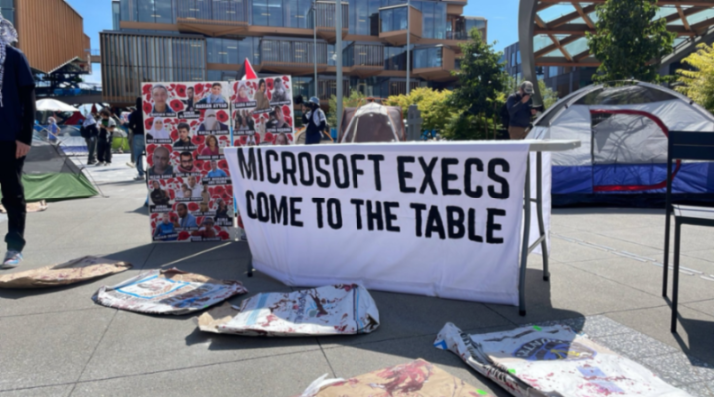 GuyOron's tweet photo. BREAKING: Current and former Microsoft workers have started an encampment at the company's Redmond, WA HQ to protest its ties to the Israeli military amid the war in Gaza. A report revealed that Microsoft servers store audio from 1 million phone calls a day made by Palestinians. https://t.co/9sGJvCjka9
