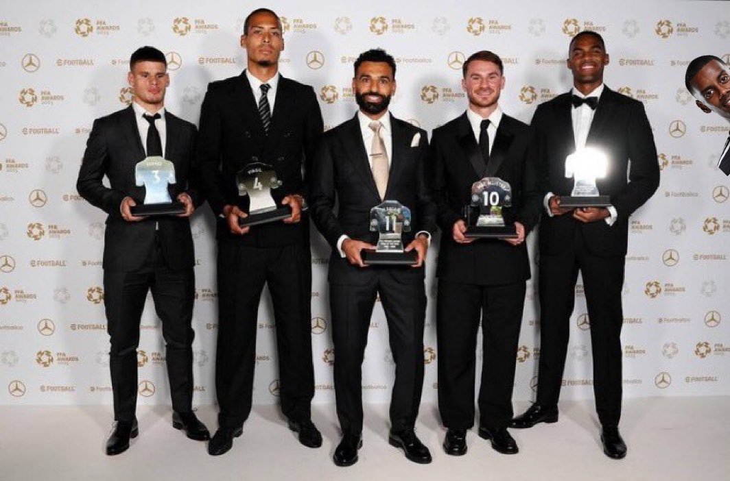 Someone made a sneak appearance for the Liverpool Team photo.

Couldn't help himself.