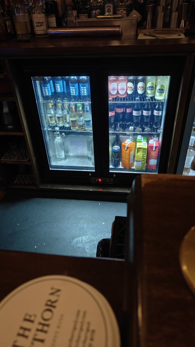 Cognitiveunflex's tweet image. Bottles look larger behind the glass than in reality. Neat trick, most probably unintended side benefit