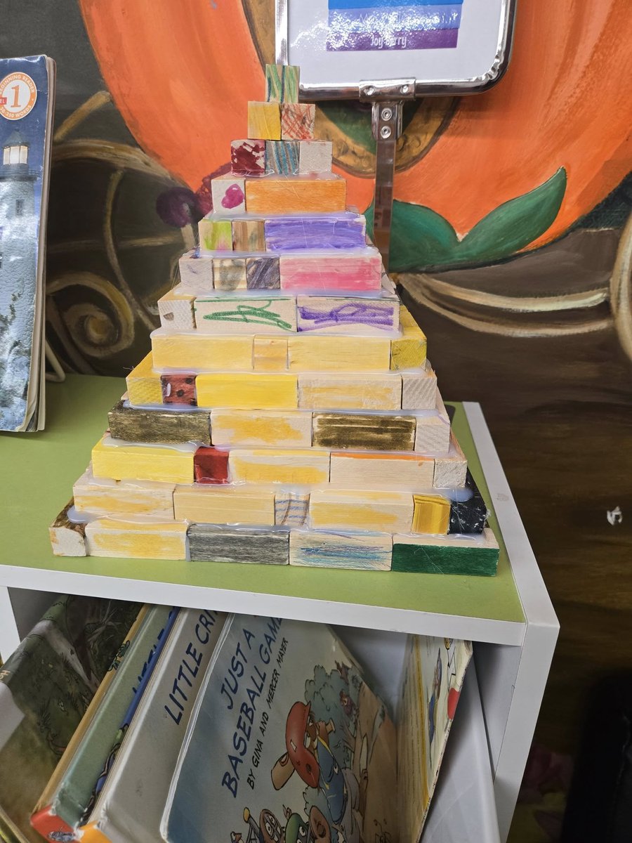 MelvilleLibrary's tweet photo. Our pyramid is complete! 
Our 4–7 year olds worked hard colouring blocks to help build this amazing pyramid, and now it’s proudly on display at the Melville Public Library! 
Come see it in person and admire their creativity — but please remember, it’s a display only. https://t.co/Lh1ux3fKYZ