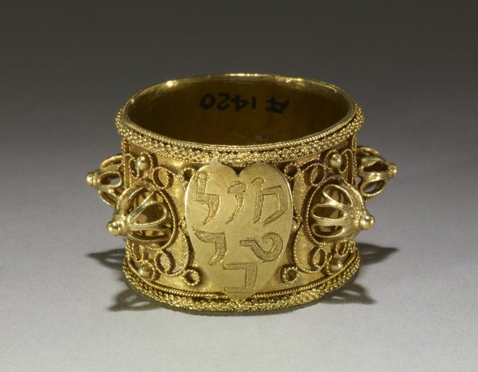 16thC Jewish wedding ring.  The centre or summit which is generally occupied by the tower, has in its place a large shield in the form of a heart with the inscription in Hebrew  Mazel-touv/Mausselauf, "Joy be with you," or "Good luck to you".  (British Museum)