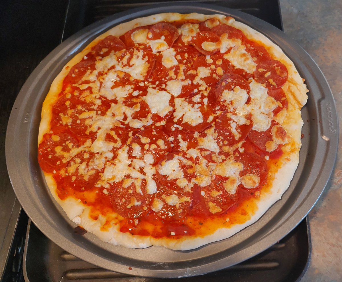 Pizza night.   It's hard to see, but the pepperoni one is completely covered in pepperonis.