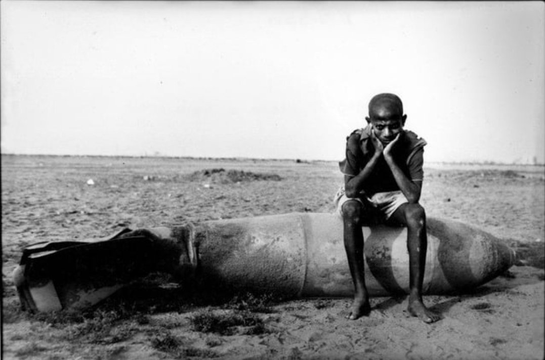 Homibsata's tweet photo. Echoes of Massawa: A Warning to Revisionists, "We Do Not Forget".

After the fall of Massawa to the Eritrean People's Liberation Front (EPLF) in February 1990, the Ethiopian Air Force engaged in a campaign of sustained and indiscriminate bombing against the city and its civilians. The attacks began just days after the EPLF captured Massawa on February 11, 1990.
The initial strikes targeted warehouses of food aid—particularly about 50,000 metric tons of US-donated wheat meant for famine relief, of which half was burned.

Napalm and  phosphorous bombs were used, and their aftermath, nearly 200 civilians—mostly women and children—were slaughtered, many forced into the unspeakable role of human shields by the retreating Ethiopian army. The bombings did not spare the innocent: they rained down on homes, aid depots, and desperate families who had fled the front lines in search of safety. 

Critical infrastructure was reduced to rubble, choking off the delivery of food aid to tens of thousands and condemning many more to hunger, suffering, and death. 

We have not forgotten those flames that scorched our people, the cries that echoed through shattered streets, or the innocent lives snuffed out beneath indiscriminate Ethiopian bombs. 
Our mothers, fathers, and children became targets in their own homes—sacrificed not for war’s logic, but to sate a vengeful state desperate to punish a people’s yearning for freedom. 
The world saw, and we remember. The air raids, napalm, cluster bombs, and phosphorus were not weapons of war but of collective terror, visited upon civilians whose only crime was to dream of self-determination.

Colonel Bezabih Petros was a pilot trained at both Williams Air Force Base in Arizona (USA) and Ligov Air Base in the USSR. He was twice shot down and captured by the Eritrean People’s Liberation Front (EPLF): first in April 1984, and again on 6 June 1998 during the Ethio-Eritrean war, after Eritrea’s liberation. While in captivity, he reflected on the bombings, stating:

           " We definitely know civilians will get hurt.  But, knowing that the people sympathise with the rebels, the order is to bomb everything that moves."

Both journalistic and human rights investigations corroborate these tolls( Human Rights Watch July 24, 1990; Africa Watch 1990, Neutered 16 May 1990, Oxford University Press,1990)

Now, after all this, the rhetoric rises again from Addis Ababa. Revisionists speak of sea access—not through dialogue or respect, but with threats and the glint of aggression, echoing past arrogance. Let them be warned: those who forget the agony they inflicted, who imagine history is theirs to rewrite, are mistaken. “History will repeat itself”—so long as you forget its darkest lessons, you set in motion the very calamities you once unleashed. The blood of Massawa is not dust on the street; it is the memory in our veins and the fire in our resolve.

To all who would trample our sovereignty, heed this: the wound is unhealed, the people unbroken, the memory unforgiving. For every threat of force, history sharpens its pen anew. Do not forget. We have not.