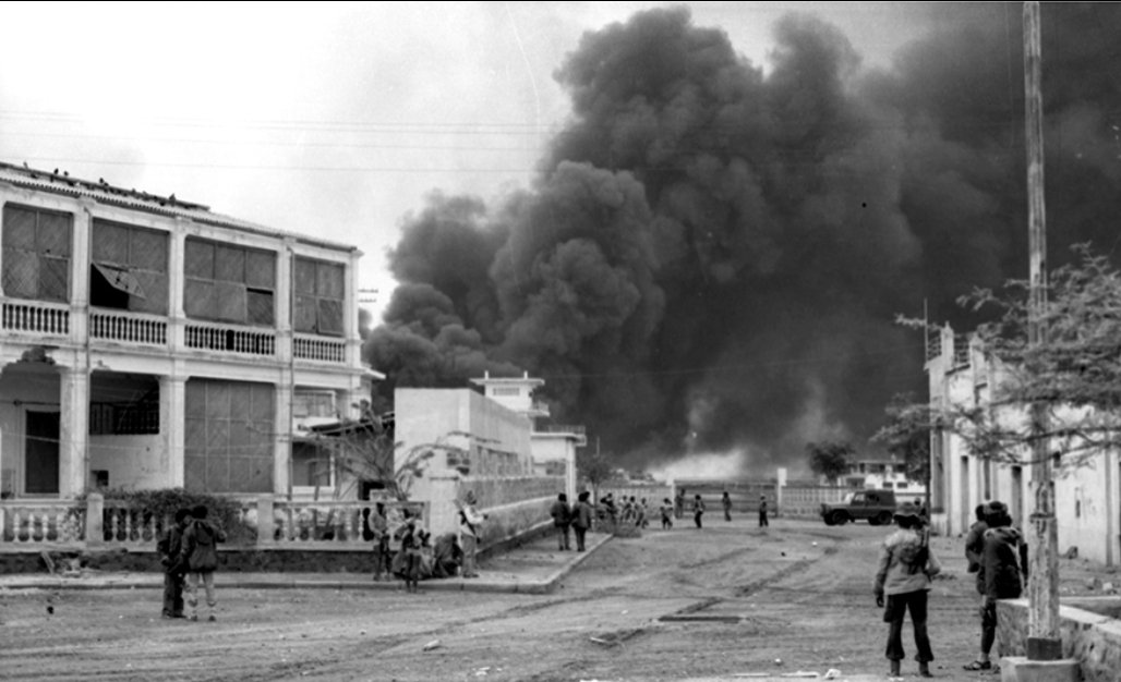 Homibsata's tweet photo. Echoes of Massawa: A Warning to Revisionists, "We Do Not Forget".

After the fall of Massawa to the Eritrean People's Liberation Front (EPLF) in February 1990, the Ethiopian Air Force engaged in a campaign of sustained and indiscriminate bombing against the city and its civilians. The attacks began just days after the EPLF captured Massawa on February 11, 1990.
The initial strikes targeted warehouses of food aid—particularly about 50,000 metric tons of US-donated wheat meant for famine relief, of which half was burned.

Napalm and  phosphorous bombs were used, and their aftermath, nearly 200 civilians—mostly women and children—were slaughtered, many forced into the unspeakable role of human shields by the retreating Ethiopian army. The bombings did not spare the innocent: they rained down on homes, aid depots, and desperate families who had fled the front lines in search of safety. 

Critical infrastructure was reduced to rubble, choking off the delivery of food aid to tens of thousands and condemning many more to hunger, suffering, and death. 

We have not forgotten those flames that scorched our people, the cries that echoed through shattered streets, or the innocent lives snuffed out beneath indiscriminate Ethiopian bombs. 
Our mothers, fathers, and children became targets in their own homes—sacrificed not for war’s logic, but to sate a vengeful state desperate to punish a people’s yearning for freedom. 
The world saw, and we remember. The air raids, napalm, cluster bombs, and phosphorus were not weapons of war but of collective terror, visited upon civilians whose only crime was to dream of self-determination.

Colonel Bezabih Petros was a pilot trained at both Williams Air Force Base in Arizona (USA) and Ligov Air Base in the USSR. He was twice shot down and captured by the Eritrean People’s Liberation Front (EPLF): first in April 1984, and again on 6 June 1998 during the Ethio-Eritrean war, after Eritrea’s liberation. While in captivity, he reflected on the bombings, stating:

           " We definitely know civilians will get hurt.  But, knowing that the people sympathise with the rebels, the order is to bomb everything that moves."

Both journalistic and human rights investigations corroborate these tolls( Human Rights Watch July 24, 1990; Africa Watch 1990, Neutered 16 May 1990, Oxford University Press,1990)

Now, after all this, the rhetoric rises again from Addis Ababa. Revisionists speak of sea access—not through dialogue or respect, but with threats and the glint of aggression, echoing past arrogance. Let them be warned: those who forget the agony they inflicted, who imagine history is theirs to rewrite, are mistaken. “History will repeat itself”—so long as you forget its darkest lessons, you set in motion the very calamities you once unleashed. The blood of Massawa is not dust on the street; it is the memory in our veins and the fire in our resolve.

To all who would trample our sovereignty, heed this: the wound is unhealed, the people unbroken, the memory unforgiving. For every threat of force, history sharpens its pen anew. Do not forget. We have not.