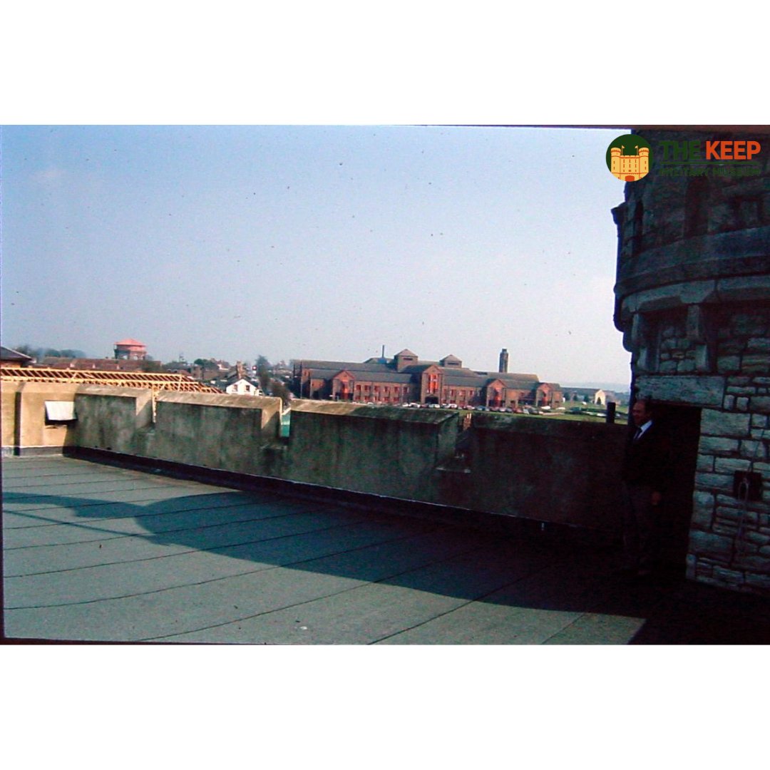 This image shows the Keep's roof before the 1994 refurbishment. The Roof had not yet received its decking and viewing platform, and the background shows the county hospital and construction on the former barracks.

DORMM:2007/979/15