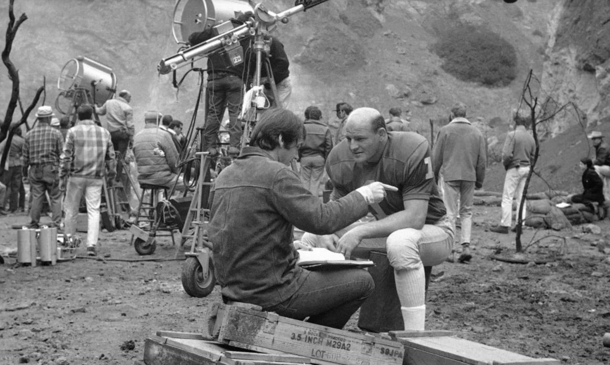 The Monkees released a movie in 1968 called Head.

Green Bay Packers legend Ray Nitschke was part of the cast.

In this photo from the set, Nitschke is talking with a young actor who co-wrote and co-produced the movie.

That young actor is Jack Nicholson.