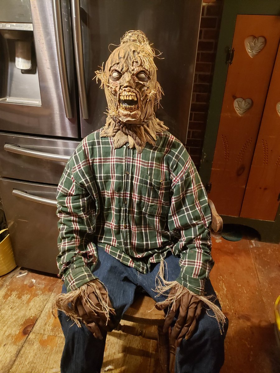 Whipped up this creepy Halloween prop in no time using just a Spirit Halloween dummy, a latex Wicked Scarecrow mask, costume gloves, and some old clothes.