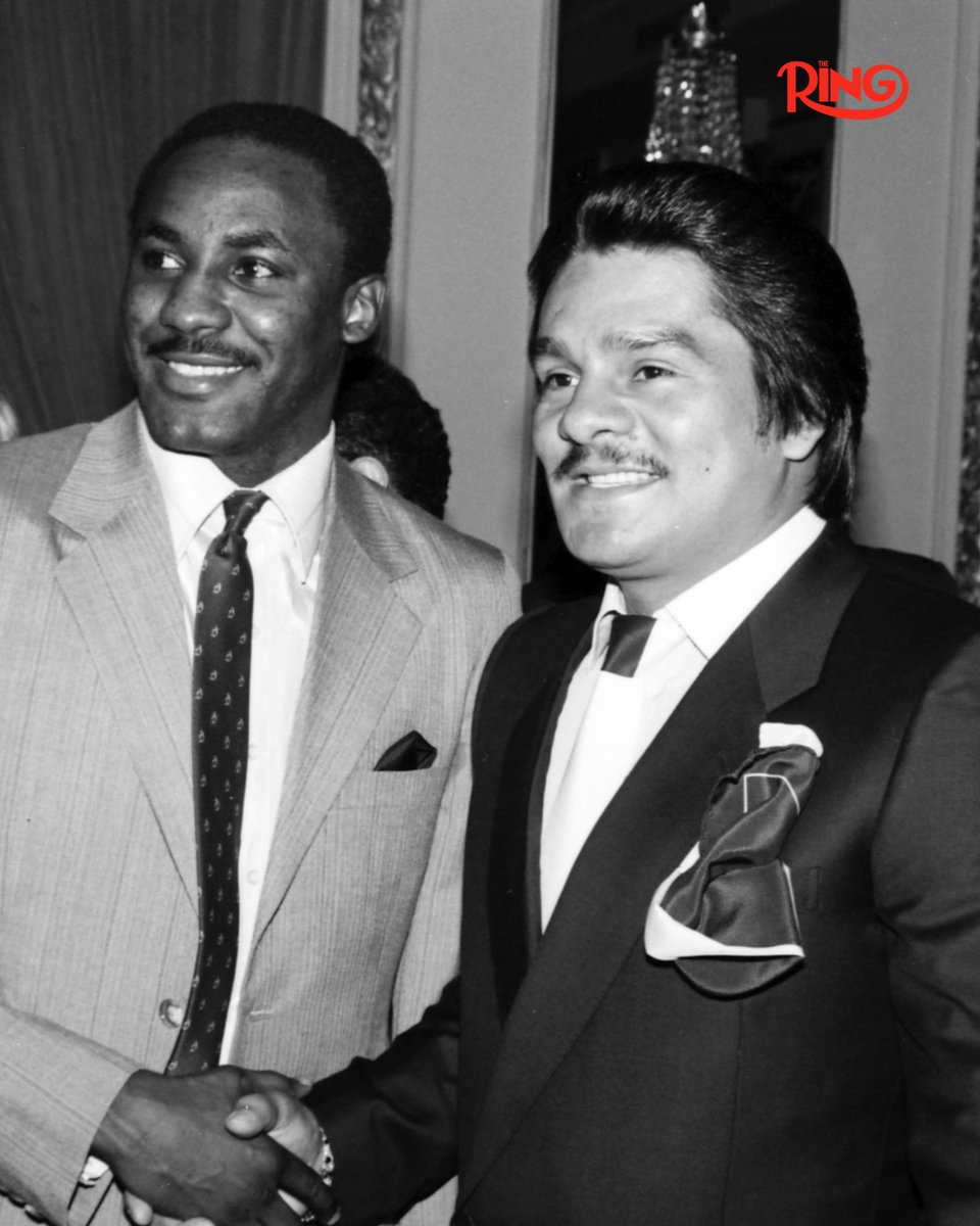 ringmagazine's tweet photo. Two of the best from the 1980's, Mike McCallum, aka "The Bodysnatcher," and Roberto Duran, aka "Hands of Stone," shake hands at a New York City press conference in 1984.

McCallum was Duran's mandatory challenger for the 154lbs world title which Roberto had won when he defeated Davey Moore the year before. However, the Panamanian chose to vacate that championship and instead battle Thomas Hearns in a big money showdown in Las Vegas.

McCallum then beat Sean Mannion to win the vacant title, while Duran would suffer a devastating 2nd round KO defeat to "Hitman" Hearns.