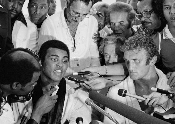 Undisputed world champion Muhammad Ali and European champ Joe Bugner meet with the press following their 15 round rematch in Kuala Lumpur, Malaysia in 1975. As in their first bout two years before in Vegas, Ali prevailed by unanimous decision. #Heavyweight #History #Boxing