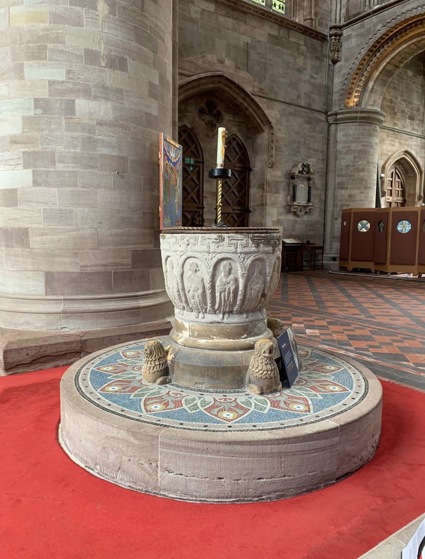 The Norman font, Hereford cathedral- carved with the figures of the apostles. Rather attractive 19th blue mosaic around the base.