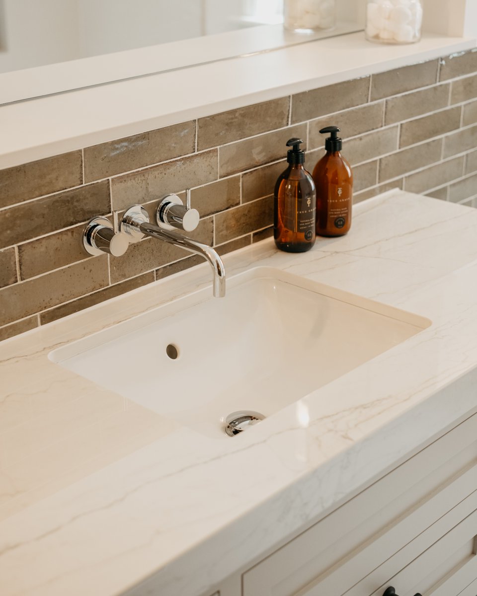 With its creamy base and delicate veining, Dekton Limbo turns a vanity into a statement.

Polished to perfection, it reflects light in a way that feels serene, softly luminous, and quietly powerful. 

📸 Shorewood Homes