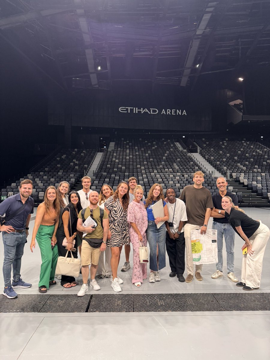 Solana team posing at Etihad Arena in Abu Dhabi for Breakpoint 2025 preparations