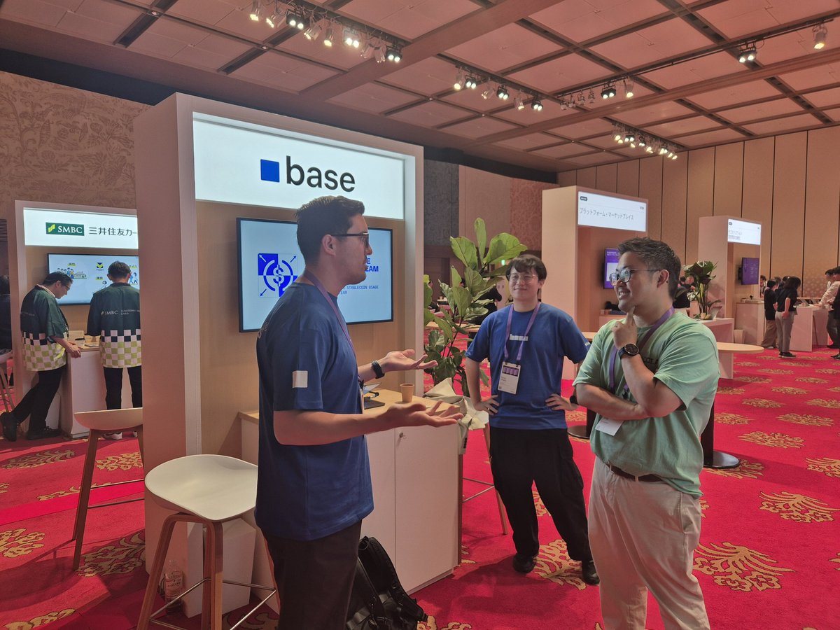 Attendees networking at the Base booth during Stripe Tours Tokyo