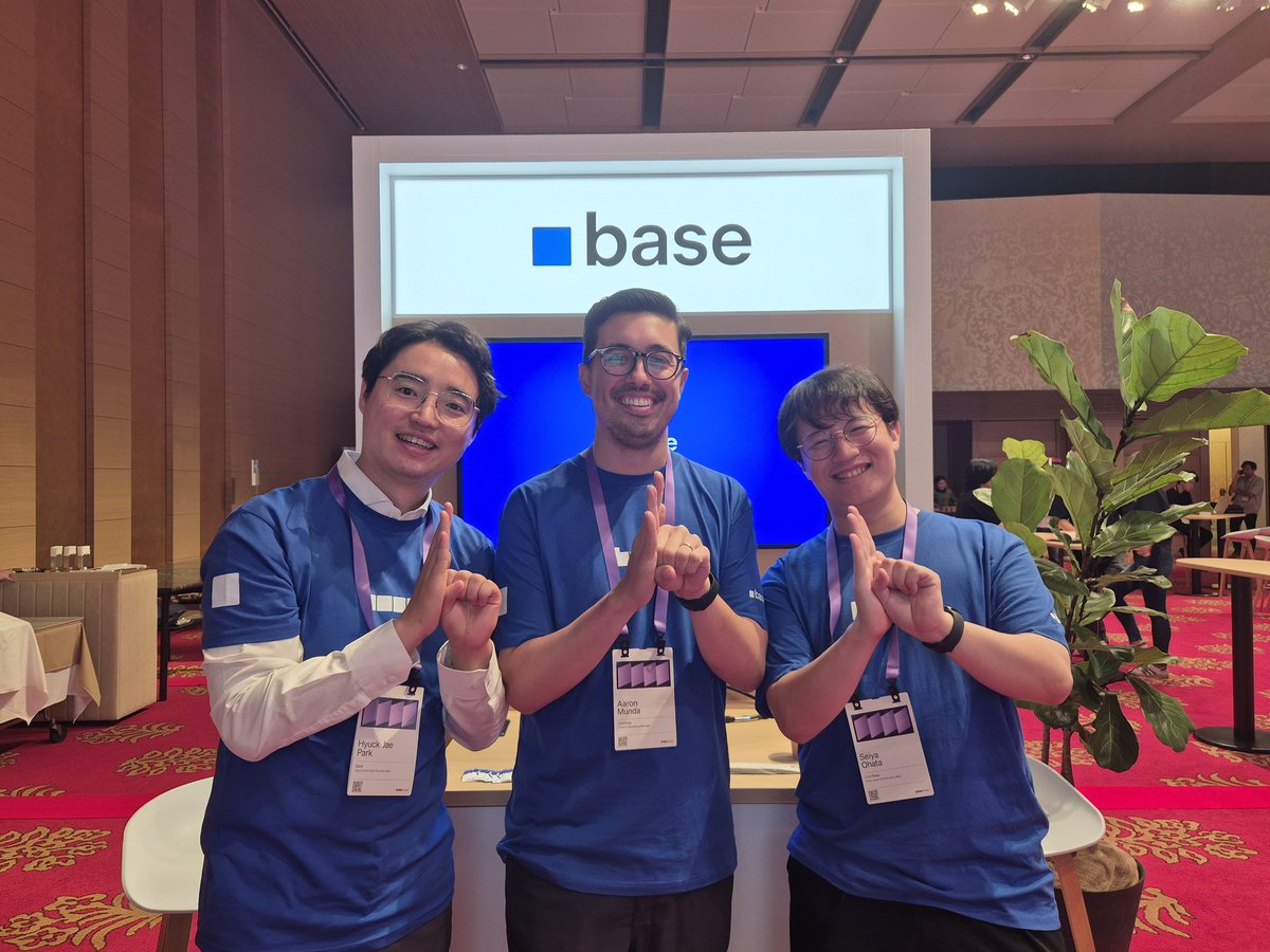 Base team members posing at the event booth
